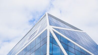 glass building under cloudy sky during daytime