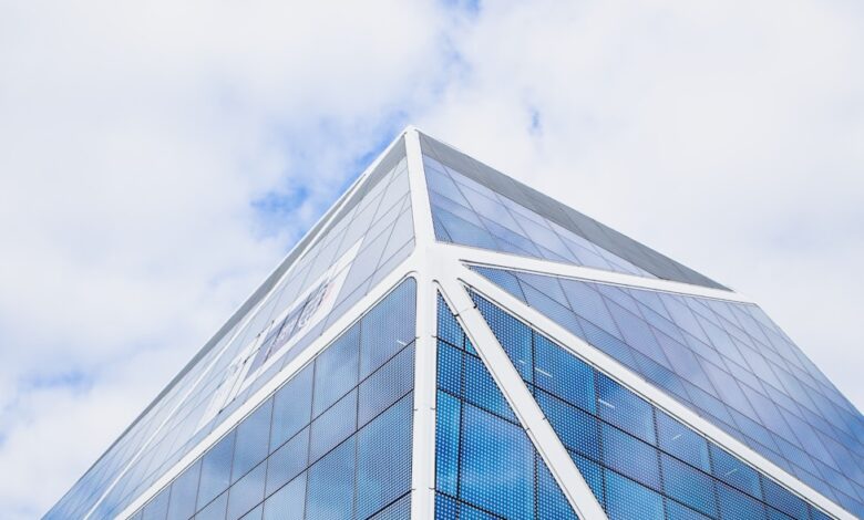 glass building under cloudy sky during daytime