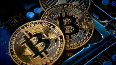 three bitcoins sitting on top of a computer motherboard