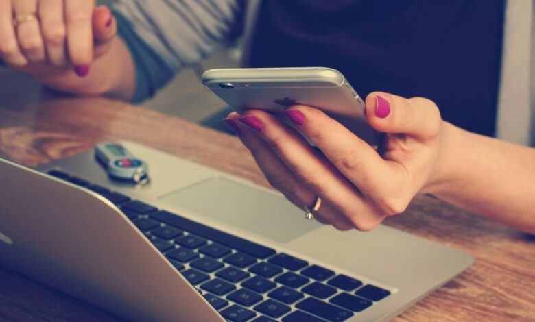 woman holding silver iPhone 6